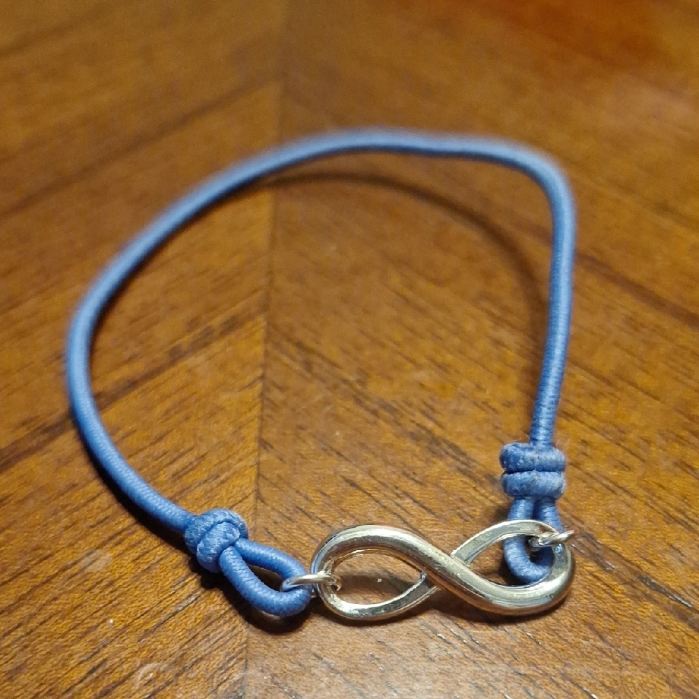 Silver Infinity Bracelet with Blue Cord